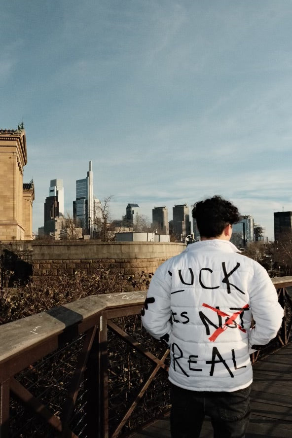“Luck Is Not Real" White Graffiti Puffer Jacket