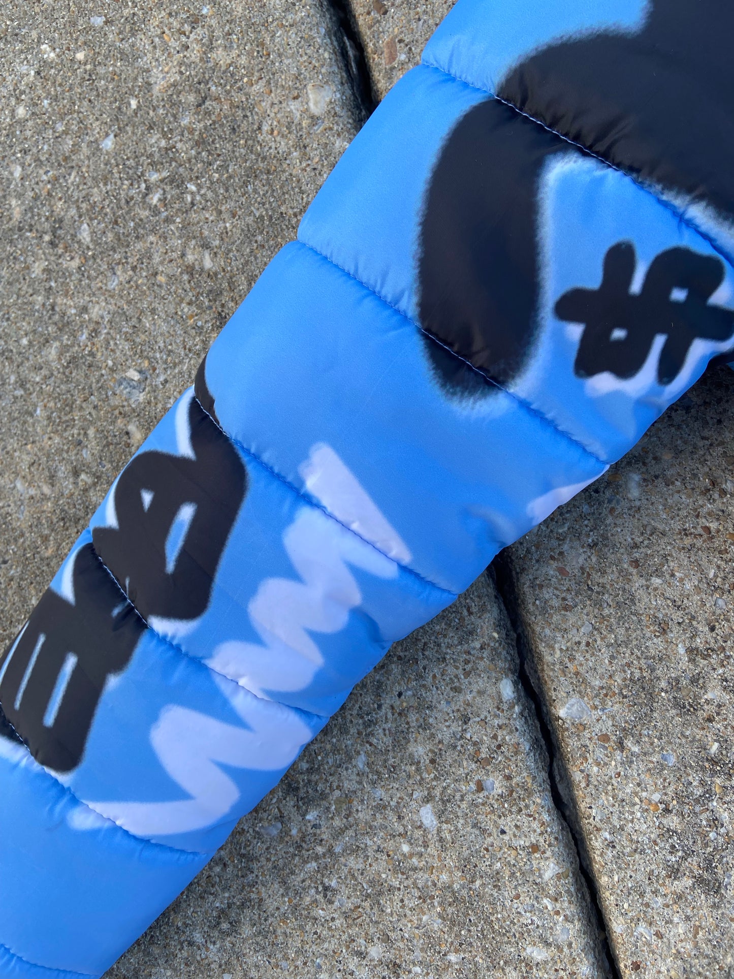 “Luck Is Not Real" Baby Blue Graffiti Puffer Jacket