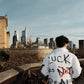 “Luck Is Not Real" White Graffiti Puffer Jacket