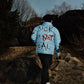 “Luck Is Not Real" Baby Blue Graffiti Puffer Jacket